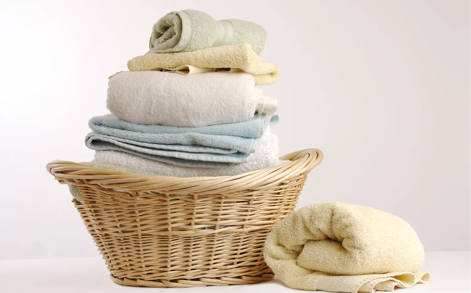 Fresh towels neatly stacked in basket